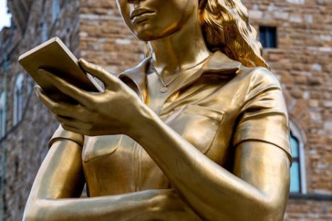 a person standing in front of a statue