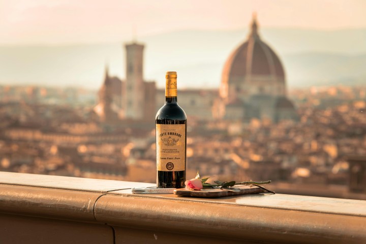 a close up of a bottle of wine sitting on top of a building