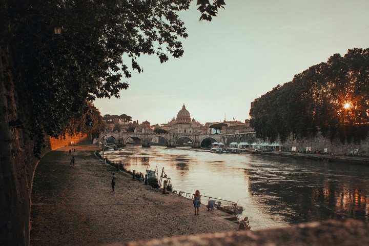 a body of water with a city in the background