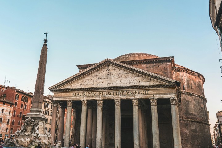 a large stone building with Pantheon, Rome in the background