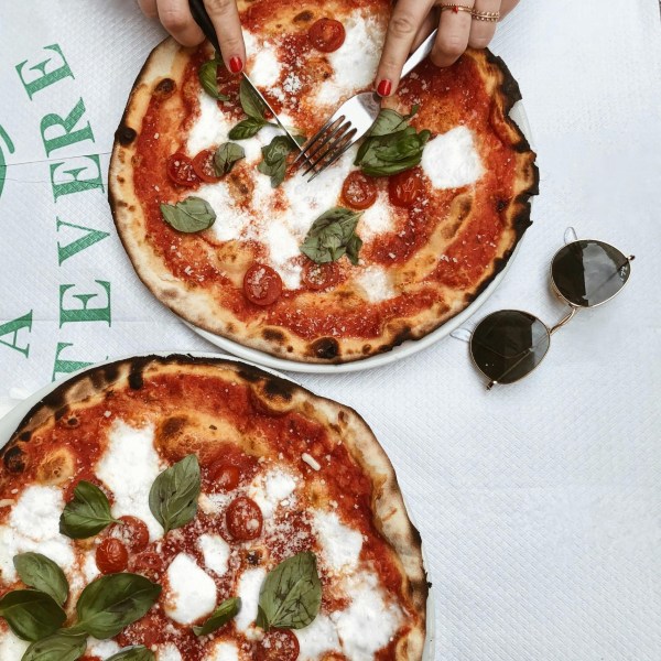 a pizza sitting on top of a cutting board