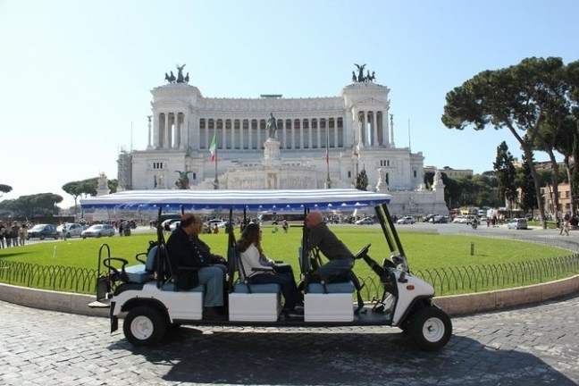 a group of people riding on the back of a truck