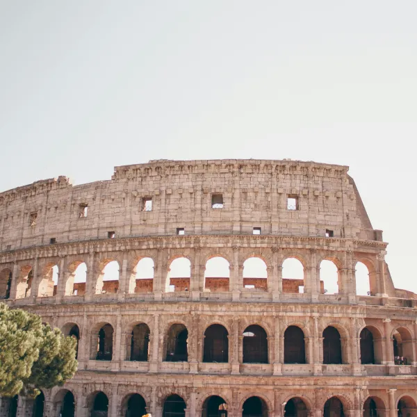 a large building with Colosseum in the background