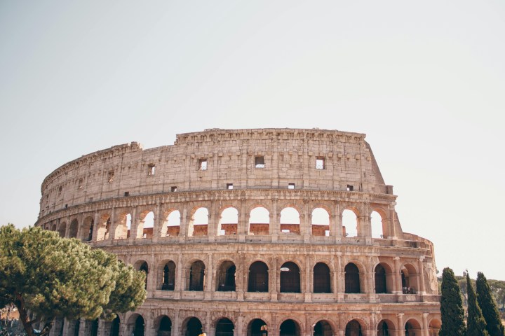 a large building with Colosseum in the background