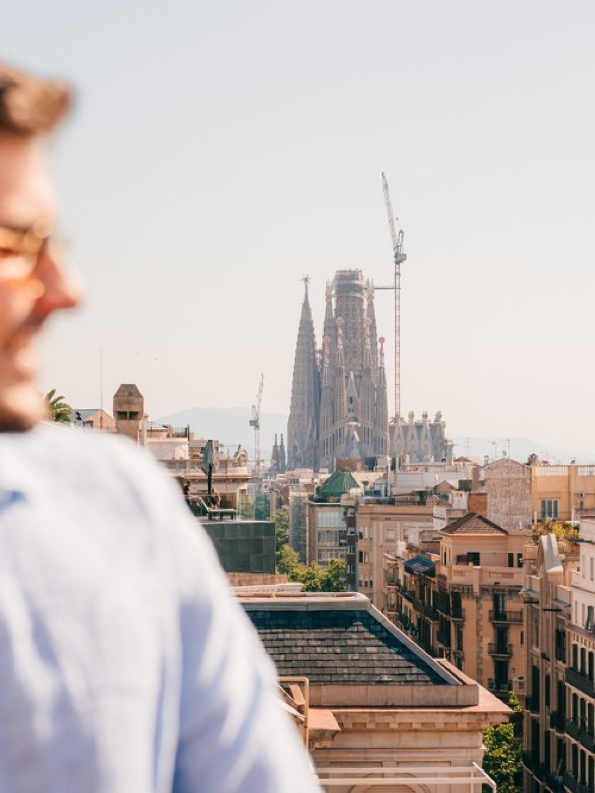 Two people in the foreground with Sagrada Familia in the background.